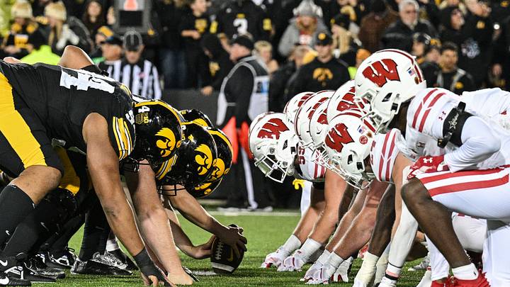 Nov 2, 2024; Iowa City, Iowa, USA; The line of scrimmage between the Iowa Hawkeyes and the Wisconsin Badgers during the fourth quarter at Kinnick Stadium. Mandatory Credit: Jeffrey Becker-Imagn Images Nov 2, 2024; Iowa City, Iowa, USA; The line of scrimmage between the Iowa Hawkeyes and the Wisconsin Badgers during the fourth quarter at Kinnick Stadium. Mandatory Credit: Jeffrey Becker-Imagn Images