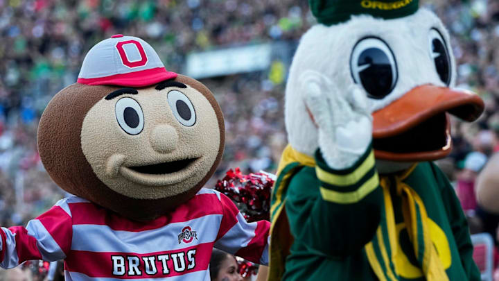 Oct 12, 2024; Eugene, Oregon, USA; Ohio State Buckeyes mascot Brutus and the Oregon Duck interact during the first half of the NCAA football game at Autzen Stadium