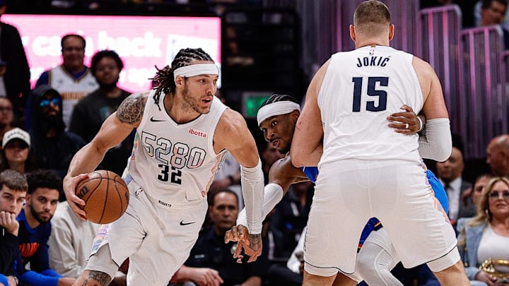 May 15, 2025; Denver, Colorado, USA; Denver Nuggets forward Aaron Gordon (32) controls the ball as center Nikola Jokic (15) screens against Oklahoma City Thunder guard Shai Gilgeous-Alexander (2) in the second quarter during game six of the second round for the 2025 NBA Playoffs at Ball Arena. Mandatory Credit: Isaiah J. Downing-Imagn Images