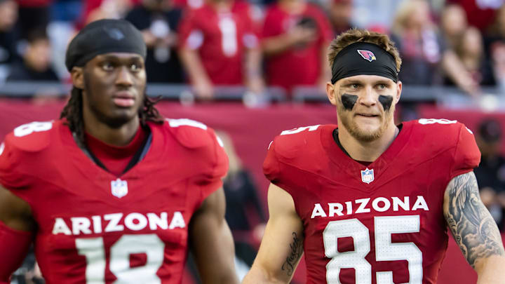 Jan 5, 2025; Glendale, Arizona, USA; Arizona Cardinals wide receiver Marvin Harrison Jr. (18) and tight end Trey McBride (85) against the San Francisco 49ers at State Farm Stadium. Mandatory Credit: Mark J. Rebilas-Imagn Images
