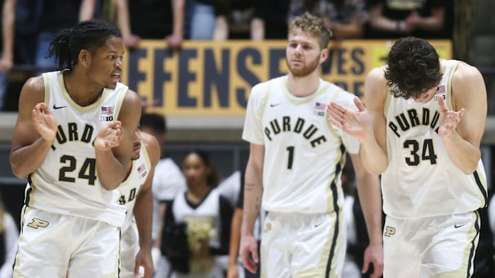 Purdue Boilermakers guard Gicarri Harris (24) and forward Raleigh Burgess (34) celebrate 