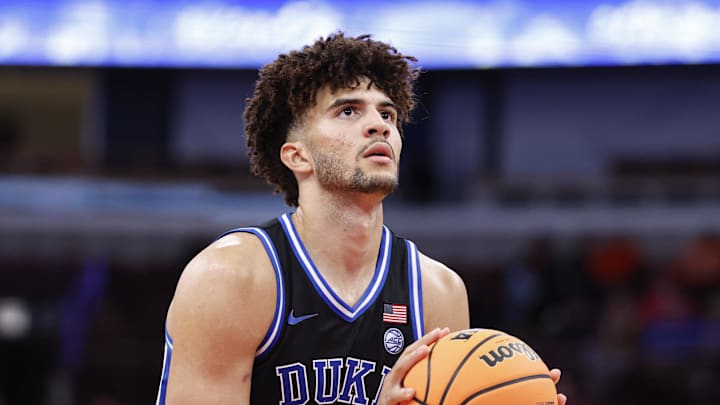 Nov 27, 2025; Chicago, Illinois, USA; Duke Blue Devils forward Cameron Boozer (12) shoots a free throw against the Arkansas Razorbacks during the second half at United Center. Mandatory Credit: Kamil Krzaczynski-Imagn Images
