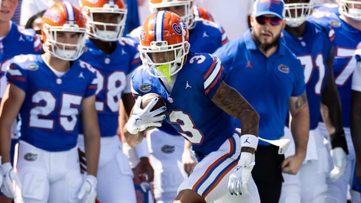 Aug 31, 2024; Gainesville, Florida, USA; Florida Gators wide receiver Eugene Wilson III (3) runs the ball for a first down against the Miami Hurricanes during the first half at Ben Hill Griffin Stadium. Mandatory Credit: Matt Pendleton-Imagn Images