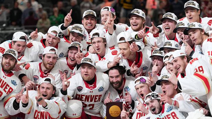 Apr 11, 2026; Las Vegas, Nevada, United States; The Denver Pioneers pose for a team photo after defeating the Wisconsin Badgers in the championship game of the NCAA men's ice hockey Frozen Four at T-Mobile Arena. Apr 11, 2026; Las Vegas, Nevada, United States; The Denver Pioneers pose for a team photo after defeating the Wisconsin Badgers in the championship game of the NCAA men's ice hockey Frozen Four at T-Mobile Arena.