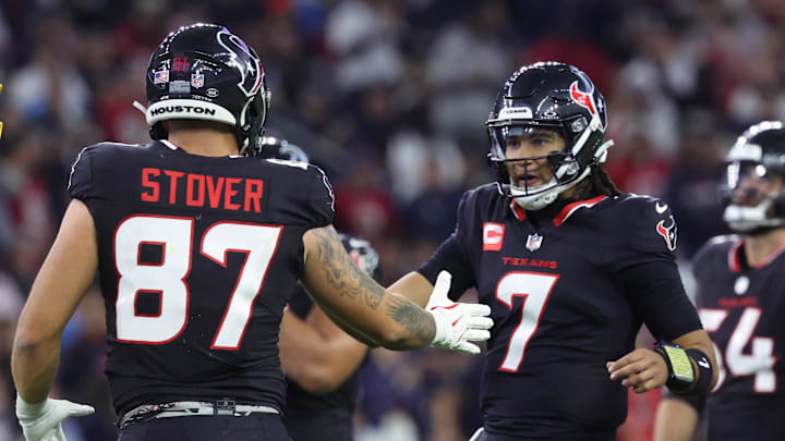 Jan 11, 2025; Houston, Texas, USA; Houston Texans quarterback C.J. Stroud (7) celebrates with tight end Cade Stover (87) after a play during the third quarter against the Los Angeles Chargers in an AFC wild card game at NRG Stadium. Mandatory Credit: Troy Taormina-Imagn Images Jan 11, 2025; Houston, Texas, USA; Houston Texans quarterback C.J. Stroud (7) celebrates with tight end Cade Stover (87) after a play during the third quarter against the Los Angeles Chargers in an AFC wild card game at NRG Stadium. Mandatory Credit: Troy Taormina-Imagn Images