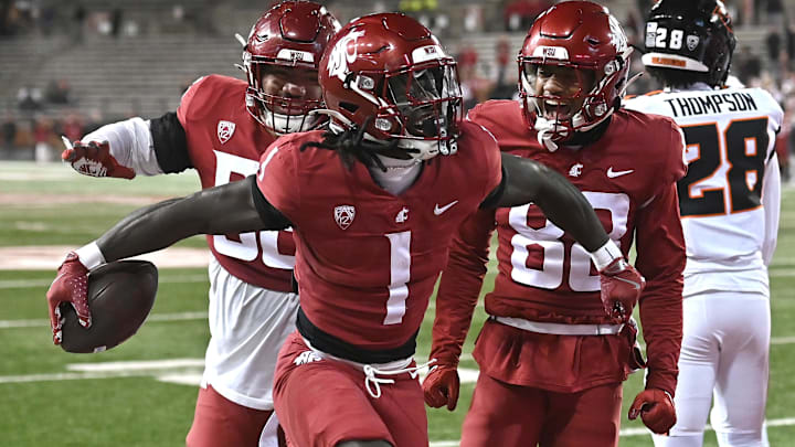 Nov 29, 2025; Pullman, Washington, USA; Washington State Cougars running back Angel Johnson (1) celebrates a a touchdown against the Oregon State Beavers in the second half at Gesa Field at Martin Stadium. Washington State Cougars won 32-8. Mandatory Credit: James Snook-Imagn Images