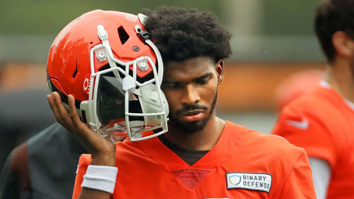 Cleveland Browns quarterback Shedeur Sanders (12) listens to the play calling on the sideline during an NFL practice at the Cleveland Browns training facility on Wednesday, May 28, 2025, in Berea, Ohio.