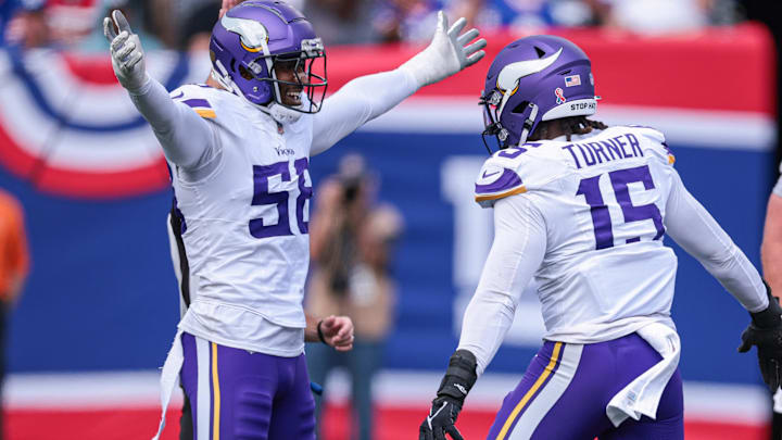 Sep 8, 2024; East Rutherford, New Jersey, USA; Minnesota Vikings linebacker Jonathan Greenard (58) celebrates a sack with linebacker Dallas Turner (15) during the first half against the New York Giants at MetLife Stadium.