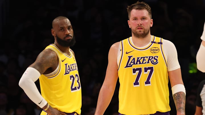 Feb 19, 2025; Los Angeles, California, USA; Los Angeles Lakers forward LeBron James (23) and guard Luka Doncic (77) during the second quarter against the Charlotte Hornets at Crypto.com Arena. Mandatory Credit: Jason Parkhurst-Imagn Images