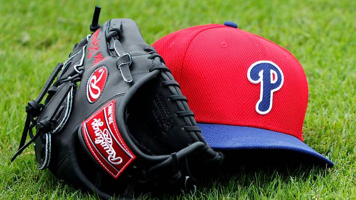 Feb 12, 2014; Clearwater, FL, USA; A general view of a Philadelphia Phillies hat and glove on the grass at Bright House Networks Field. Feb 12, 2014; Clearwater, FL, USA; A general view of a Philadelphia Phillies hat and glove on the grass at Bright House Networks Field.
