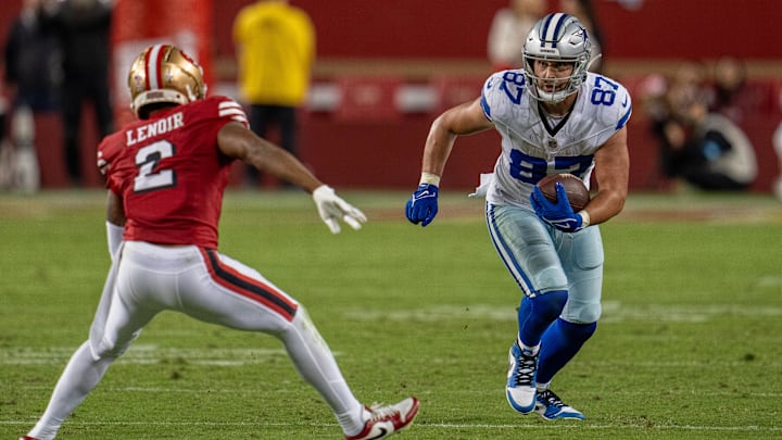 Dallas Cowboys TE Jake Ferguson runs with the football after the catch against San Francisco 49ers CB Deommodore Lenoir.