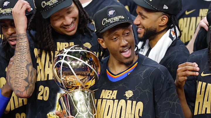 Jun 22, 2025; Oklahoma City, Oklahoma, USA; Oklahoma City Thunder forward Jalen Williams (8) holds the NBA Larry O'Brien Championship Trophy at the end of game seven of the 2025 NBA Finals after defeating the Indiana Pacers at Paycom Center. Mandatory Credit: Alonzo Adams-Imagn Images