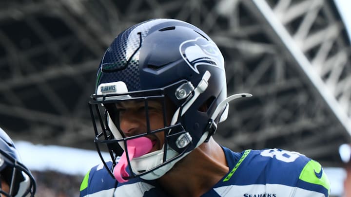 Seattle Seahawks running back George Holani celebrates with Seattle Seahawks wide receiver Cody White.