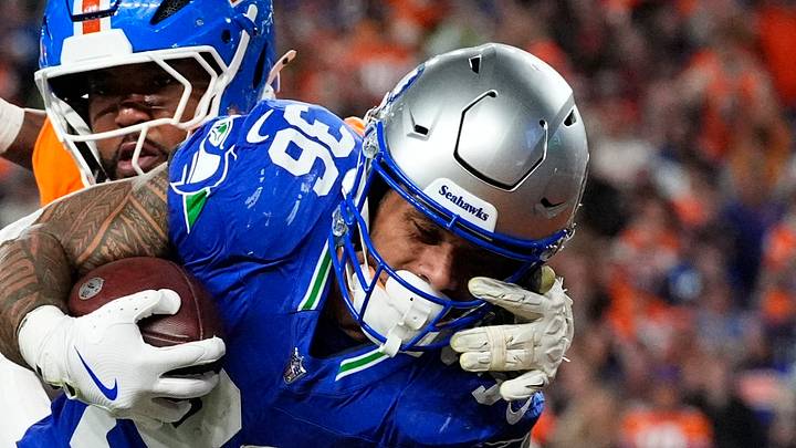 Seattle Seahawks running back George Holani carries the ball for a touchdown. Seattle Seahawks running back George Holani carries the ball for a touchdown.