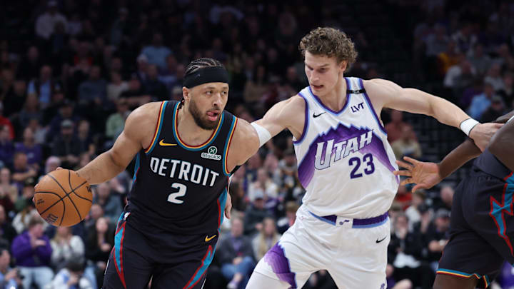 Dec 26, 2025; Salt Lake City, Utah, USA; Detroit Pistons guard Cade Cunningham (2) moves the ball against Utah Jazz forward Lauri Markkanen (23) during the first quarter at Delta Center. Mandatory Credit: Rob Gray-Imagn Images