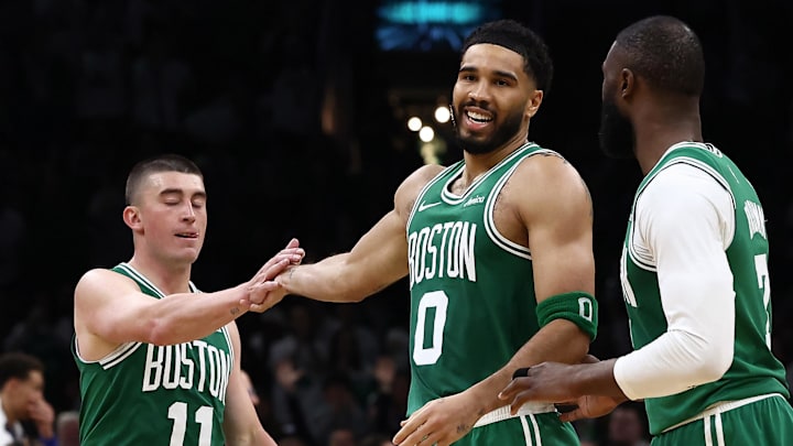 Mar 6, 2026; Boston, Massachusetts, USA; Boston Celtics forward Jayson Tatum (0) smiles at Boston Celtics guard Jaylen Brown (7) while being congratulated by guard Payton Pritchard (11) during the second half at TD Garden. Mandatory Credit: Winslow Townson-Imagn Images