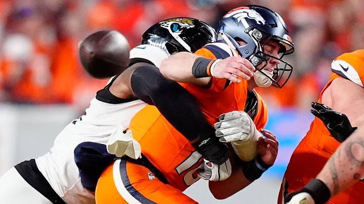 Jacksonville Jaguars defensive end Travon Walker (44) hits Denver Broncos quarterback Bo Nix (10) during the second half at Empower Field at Mile High. Jacksonville Jaguars defensive end Travon Walker (44) hits Denver Broncos quarterback Bo Nix (10) during the second half at Empower Field at Mile High.