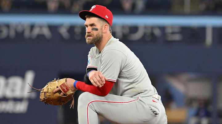 Jun 4, 2025; Toronto, Ontario, CAN; Philadelphia Phillies first baseman Bryce Harper (3) looks on during an injury delay in the ninth inning against the Toronto Blue Jays at Rogers Centre. Jun 4, 2025; Toronto, Ontario, CAN; Philadelphia Phillies first baseman Bryce Harper (3) looks on during an injury delay in the ninth inning against the Toronto Blue Jays at Rogers Centre.