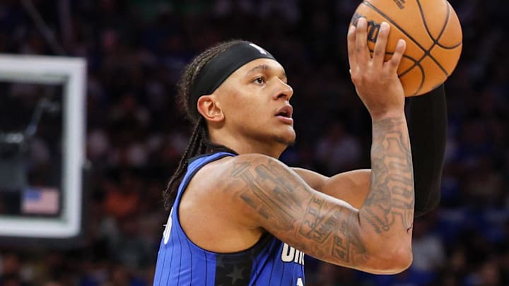 Apr 27, 2025; Orlando, Florida, USA; Orlando Magic forward Paolo Banchero (5) shoots a three point shot against the Boston Celtics in the first quarter during game four of first round for the 2025 NBA Playoffs at Kia Center. Mandatory Credit: Nathan Ray Seebeck-Imagn Images Apr 27, 2025; Orlando, Florida, USA; Orlando Magic forward Paolo Banchero (5) shoots a three point shot against the Boston Celtics in the first quarter during game four of first round for the 2025 NBA Playoffs at Kia Center. Mandatory Credit: Nathan Ray Seebeck-Imagn Images