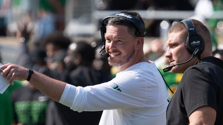 Oregon Head Coach Dan Lanning, left, and Defensive Coordinator Tosh Lupoi discus their game plan during the game against Oklahoma State. Oregon Head Coach Dan Lanning, left, and Defensive Coordinator Tosh Lupoi discus their game plan during the game against Oklahoma State.