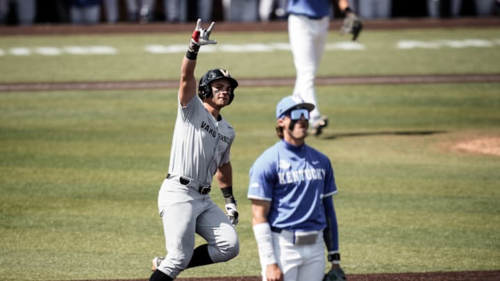 Will Hampton celebrates a grand slam against Kentucky on April 19.