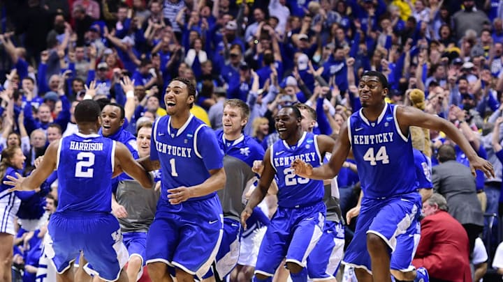Mar 30, 2014; Indianapolis, IN, USA; Kentucky Wildcats players including Aaron Harrison (2) , James Young (1) and Dakari Johnson (44) celebrate after defeating the Michigan Wolverines in the finals of the midwest regional of the 2014 NCAA Mens Basketball Championship tournament at Lucas Oil Stadium. Mandatory Credit: Bob Donnan-Imagn Images