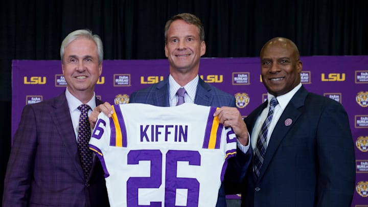Dec 1, 2025; Baton Rouge, LA, USA; LSU president Wade Rousse, left, LSU new head coach Lane Kiffin and LSU athletic director Verge Ausberry stand together at South Stadium Club at Tiger Stadium. Mandatory Credit: Matthew Hinton-Imagn Images
