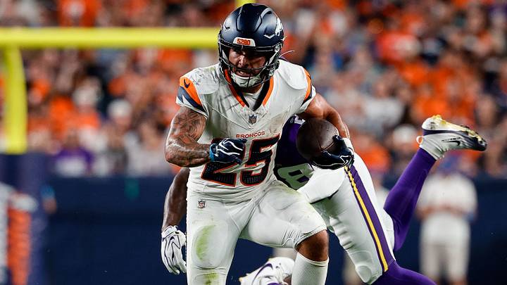 Aug 28, 2026; Denver, Colorado, USA; Denver Broncos running back Cody Schrader (25) runs the ball against Minnesota Vikings cornerback Bryce Phillips (28) and cornerback Jarrod Washington (35) in the third quarter at Empower Field at Mile High. Aug 28, 2026; Denver, Colorado, USA; Denver Broncos running back Cody Schrader (25) runs the ball against Minnesota Vikings cornerback Bryce Phillips (28) and cornerback Jarrod Washington (35) in the third quarter at Empower Field at Mile High.
