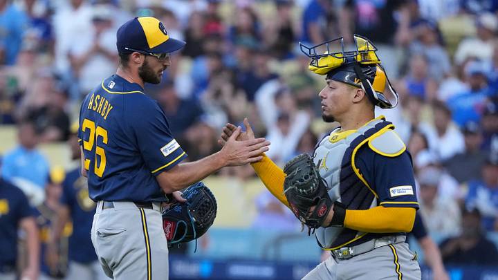 Aug 15, 2026; Los Angeles, California, USA; Milwaukee Brewers pitcher Aaron Ashby (26) and catcher William Contreras (24) react at the end of the game against the Los Angeles Dodgers at Dodger Stadium. Mandatory Credit: Kirby Lee-Imagn Images Aug 15, 2026; Los Angeles, California, USA; Milwaukee Brewers pitcher Aaron Ashby (26) and catcher William Contreras (24) react at the end of the game against the Los Angeles Dodgers at Dodger Stadium. Mandatory Credit: Kirby Lee-Imagn Images