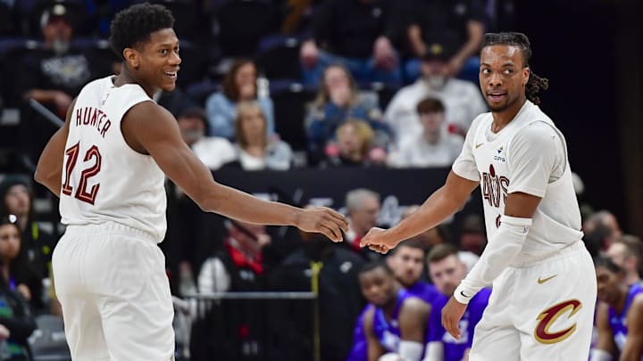 Mar 23, 2025; Salt Lake City, Utah, USA; Cleveland Cavaliers guard Darius Garland (10) and Cleveland Cavaliers forward/guard De'Andre Hunter (12) celebrate after a three point shot against the Utah Jazz during the second half at Delta Center. Mandatory Credit: Peter Creveling-Imagn Images