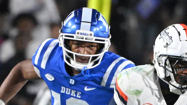 Nov 15, 2025; Durham, North Carolina, USA; Virginia Cavaliers wide receiver Trell Harris (11) runs the ball against Duke Blue Devils defensive end Tyshon Reed (10) during the third quarter at Wallace Wade Stadium. Mandatory Credit: Zachary Taft-Imagn Images Nov 15, 2025; Durham, North Carolina, USA; Virginia Cavaliers wide receiver Trell Harris (11) runs the ball against Duke Blue Devils defensive end Tyshon Reed (10) during the third quarter at Wallace Wade Stadium. Mandatory Credit: Zachary Taft-Imagn Images