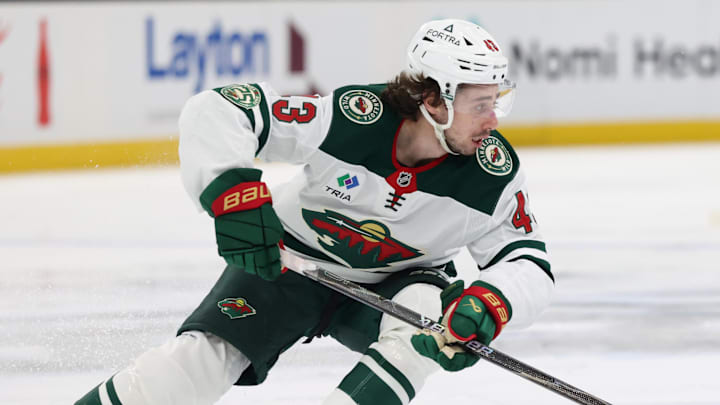 Feb 27, 2026; Salt Lake City, Utah, USA; Minnesota Wild defenseman Quinn Hughes (43) controls the puck against the Utah Mammoth during the second period at Delta Center. Mandatory Credit: Rob Gray-Imagn Images