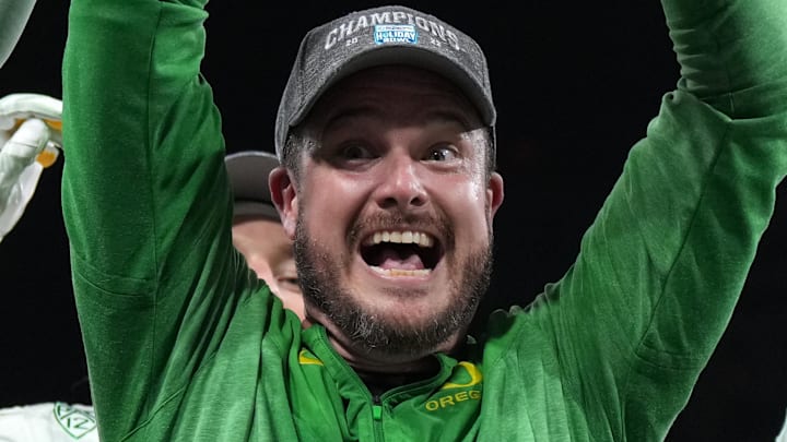 Dec 28, 2022; San Diego, CA, USA; Oregon Ducks head coach Dan Lanning celebrates with the championship trophy after the 2022 Holiday Bowl against the North Carolina Tar Heels at Petco Park. Mandatory Credit: Kirby Lee-Imagn Images