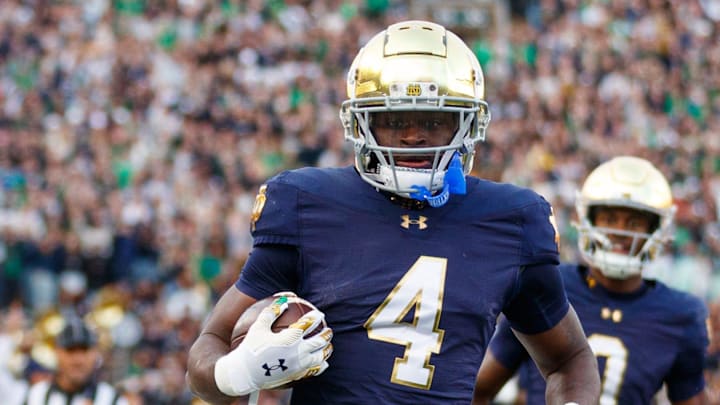 Notre Dame running back Jeremiyah Love (4) runs the ball into the end zone for a touchdown in the first half of a NCAA football game against Syracuse at Notre Dame Stadium on Saturday, Nov. 22, 2025, in South Bend.