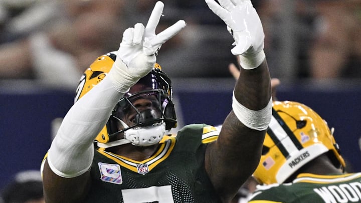 Green Bay Packers linebacker Quay Walker (7) celebrates after making a play against the Cowboys.