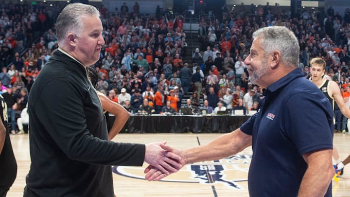 Purdue Boilermakers head coach Matt Painter and Auburn Tigers head coach Bruce Pearl shake hands after the game Purdue Boilermakers head coach Matt Painter and Auburn Tigers head coach Bruce Pearl shake hands after the game