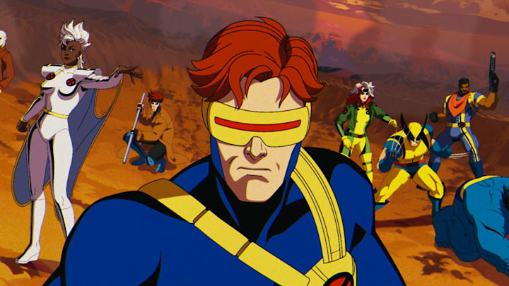 (L-R): Morph (voiced by JP Karliak), Storm (voiced by Alison Sealy-Smith), Gambit (voiced by AJ LoCascio), Cyclops (voiced by Ray Chase), Rogue (voiced by Lenore Zann), Wolverine (voiced by Cal Dodd), Bishop (voiced by Isaac Robinson-Smith), Beast (voiced by George Buza) in Marvel Animation's X-MEN '97. Photo courtesy of Marvel Animation. © 2024 MARVEL.