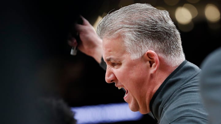 Purdue Boilermakers head coach Matt Painter leads a timeout 