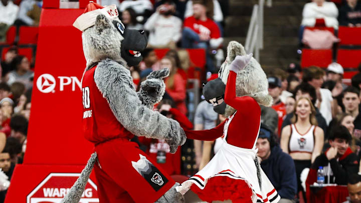 Jan 27, 2026; Raleigh, North Carolina, USA; NC State Wolfpack mascots dance during the second half of the game against the Syracuse Orange at Lenovo Center. Mandatory Credit: Jaylynn Nash-Imagn Images