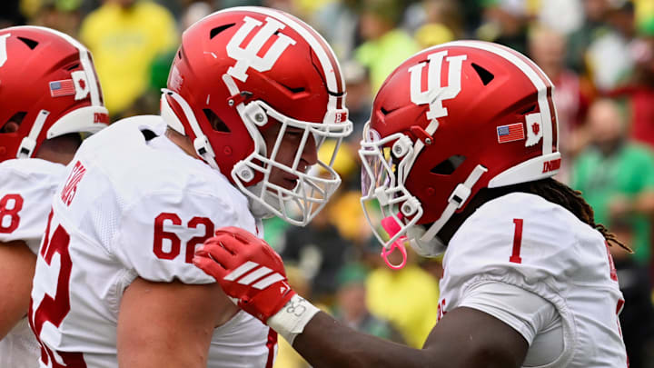 Indiana's Roman Hemby celebrates with Drew Evans after scoring a touchdown Oct. 11, 2025, against Oregon at Autzen Stadium.