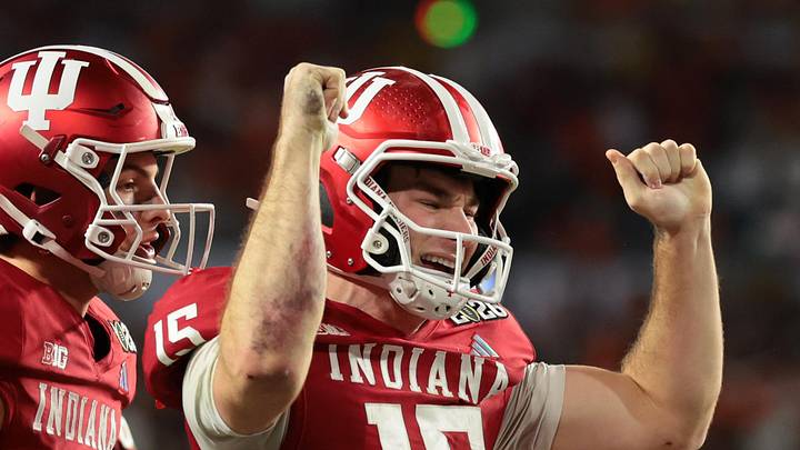 Jan 19, 2026; Miami Gardens, FL, USA; Indiana Hoosiers quarterback Fernando Mendoza (15) celebrates after scoring a touchdown against the Miami Hurricanes in the fourth quarter during the College Football Playoff National Championship game at Hard Rock Stadium. Mandatory Credit: Sam Navarro-Imagn Images