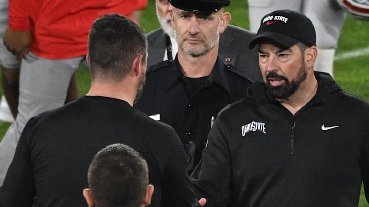 Jan 1, 2025; Pasadena, CA, USA; Ohio State Buckeyes head coach Ryan Day (right) shakes hands with Oregon Ducks head coach Dan Lanning at the conclusion of the Rose Bowl game at Rose Bowl Stadium. Mandatory Credit: Robert Hanashiro-Imagn Images Jan 1, 2025; Pasadena, CA, USA; Ohio State Buckeyes head coach Ryan Day (right) shakes hands with Oregon Ducks head coach Dan Lanning at the conclusion of the Rose Bowl game at Rose Bowl Stadium. Mandatory Credit: Robert Hanashiro-Imagn Images
