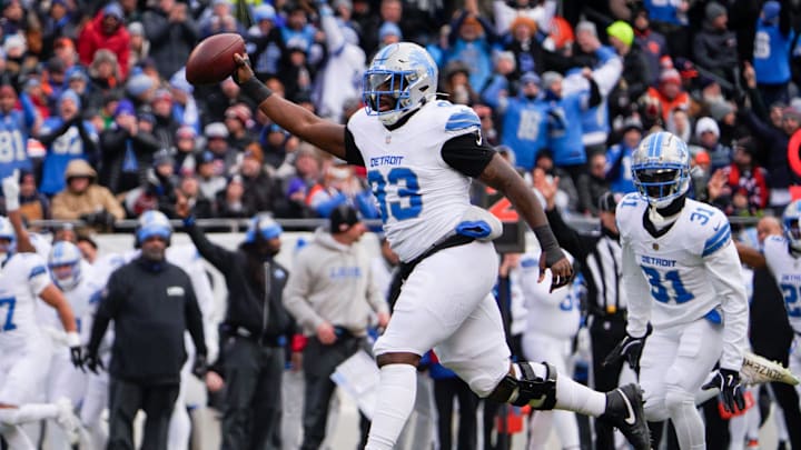 Detroit Lions defensive end Josh Paschal (93) celebrates after receiving the fumble at Soldier Field Detroit Lions defensive end Josh Paschal (93) celebrates after receiving the fumble at Soldier Field