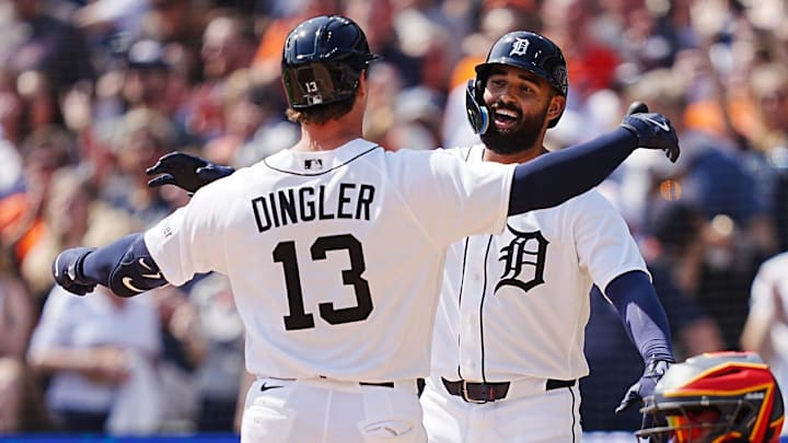 Detroit Tigers catcher Dillon Dingler (13) crosses home and embraces Detroit Tigers left fielder Riley Greene (31) after hitting a home run. 