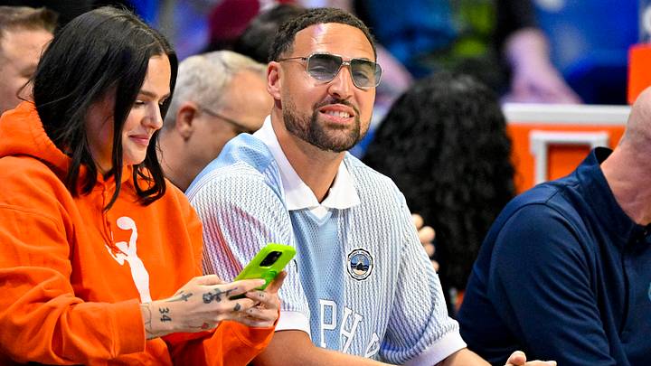 Jun 20, 2026; Arlington, Texas, USA; Dallas Mavericks guard Klay Thompson watches the game between the Dallas Wings and the Chicago Sky during the first half at College Park Center. Mandatory Credit: Jerome Miron-Imagn Images Jun 20, 2026; Arlington, Texas, USA; Dallas Mavericks guard Klay Thompson watches the game between the Dallas Wings and the Chicago Sky during the first half at College Park Center. Mandatory Credit: Jerome Miron-Imagn Images