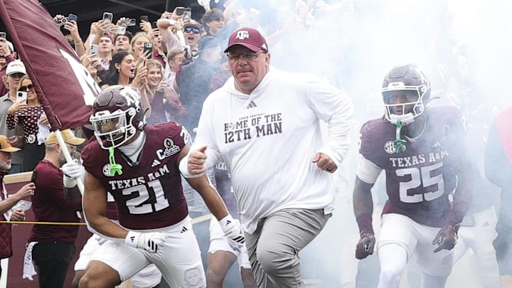 Texas A&M Aggies head coach Mike Elko takes the field prior to the game against the Miami Hurricanes during the first round of the CFP National Playoff at Kyle Field. Mandatory Credit: Maria Lysaker-Imagn Images