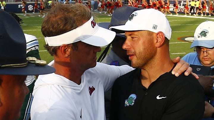 Sep 20, 2025; Oxford, Mississippi, USA; Mississippi Rebels head coach Lane Kiffin (left) and Tulane Green Wave head coach Jon Sumrall (right) embrace after the game at Vaught-Hemingway Stadium. Mandatory Credit: Petre Thomas-Imagn Images