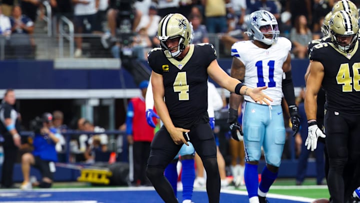 Sep 15, 2024; Arlington, Texas, USA; New Orleans Saints quarterback Derek Carr (4) celebrates after scoring a touchdown  during the first half against the Dallas Cowboys at AT&T Stadium. Mandatory Credit: Kevin Jairaj-Imagn Images