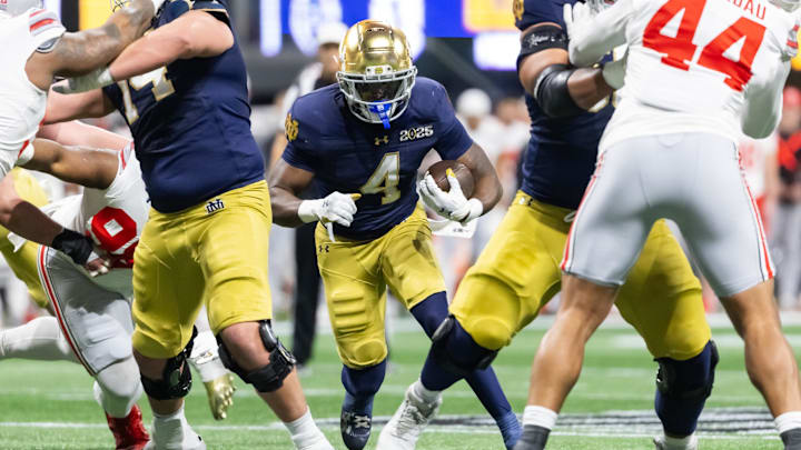 Jan 20, 2025; Atlanta, GA, USA; Notre Dame Fighting Irish running back Jeremiyah Love (4) against the Ohio State Buckeyes during the CFP National Championship college football game at Mercedes-Benz Stadium. 