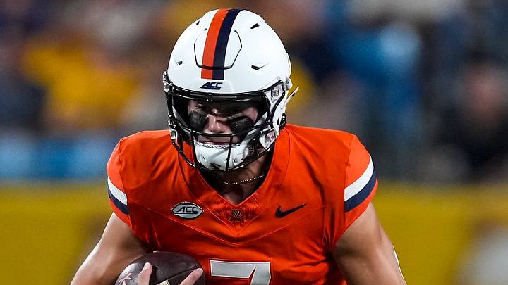 Sep 19, 2026; Charlotte, North Carolina, USA; Virginia Cavaliers quarterback Beau Pribula (7) keeps the ball and runs against the West Virginia Mountaineers during the first quarter at Bank of America Stadium. Mandatory Credit: Jim Dedmon-Imagn Images Sep 19, 2026; Charlotte, North Carolina, USA; Virginia Cavaliers quarterback Beau Pribula (7) keeps the ball and runs against the West Virginia Mountaineers during the first quarter at Bank of America Stadium. Mandatory Credit: Jim Dedmon-Imagn Images